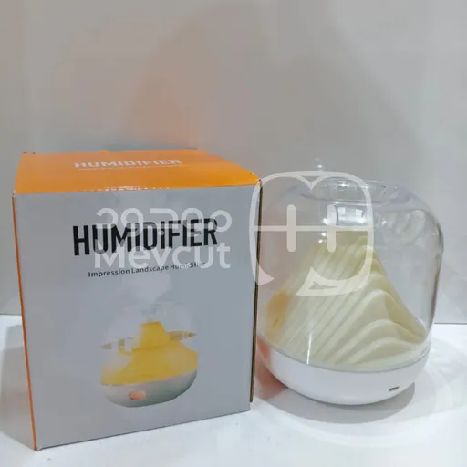 مبخرة عطرية بشكل جبل داخل غطاء شفاف