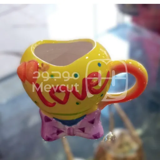 كوب سيراميك مزخرف على شكل وجه مبتسم